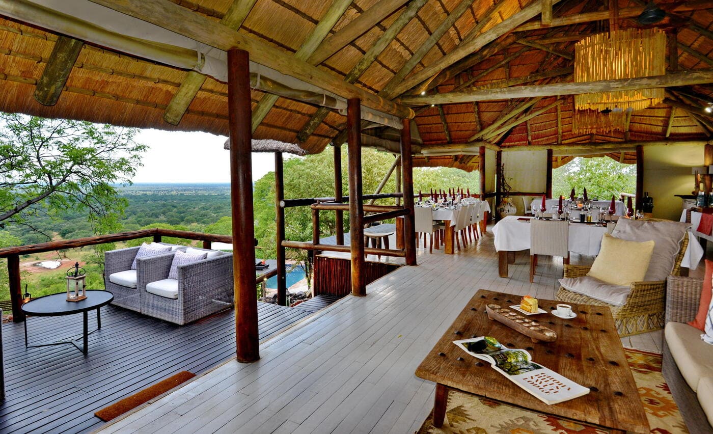 Elevated restaurant and lounge terrace at Ghoha Hills Savuti Lodge overlooking the surrounding wilderness.