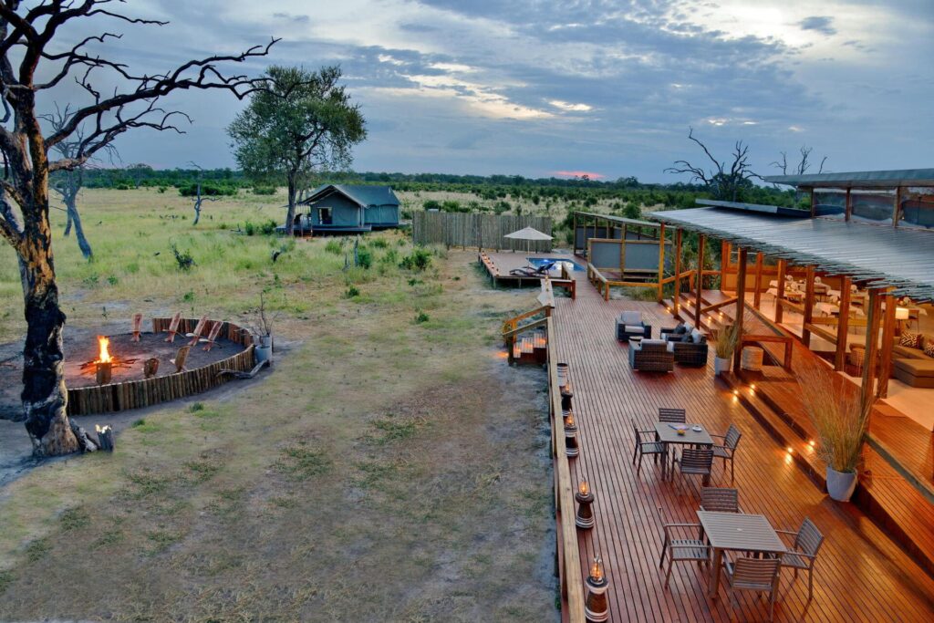 Elevated deck and firepit area with views of the surrounding pans at Nogatsaa Pans Lodge.