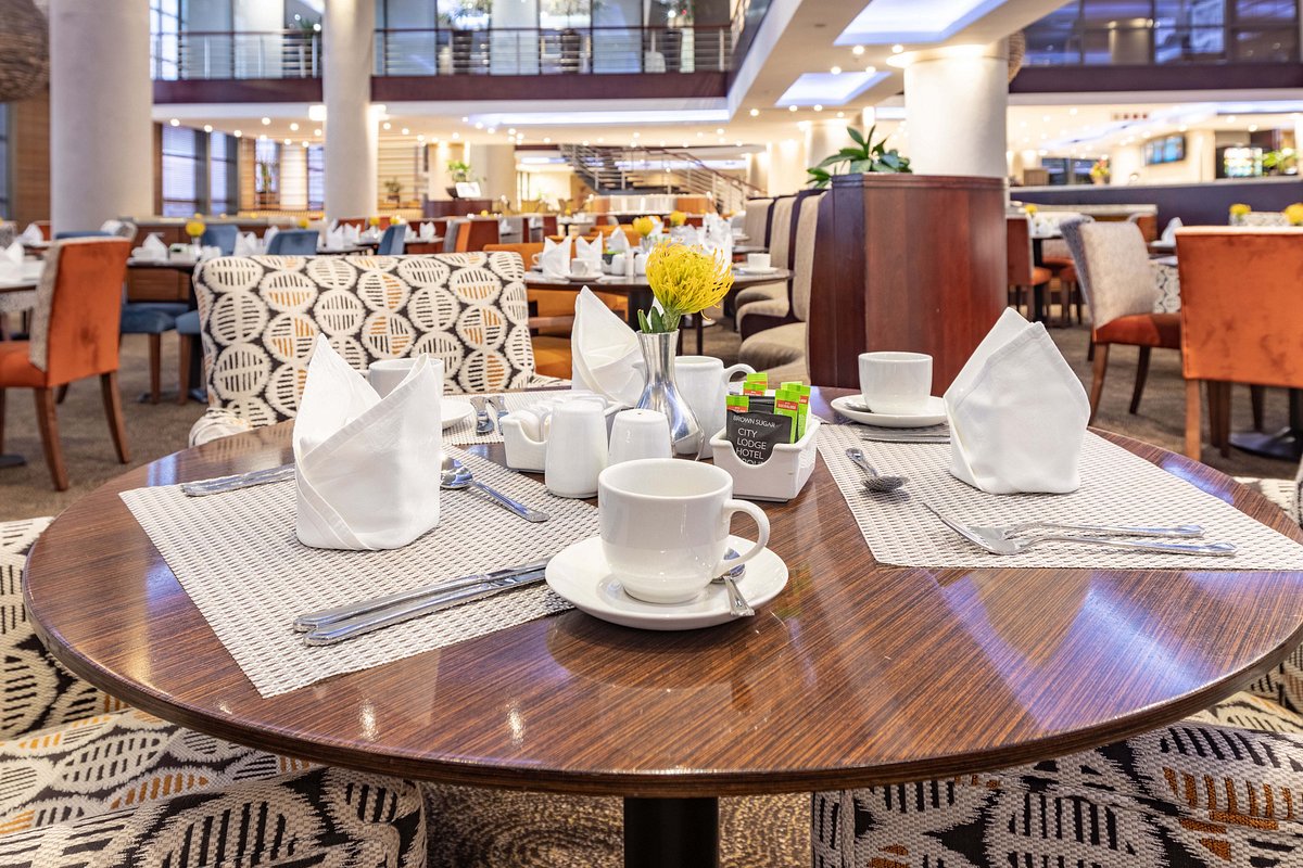 Restaurant dining area at City Lodge Hotel O.R. Tambo Airport, offering convenient on-site meals for overnight and transit guests.