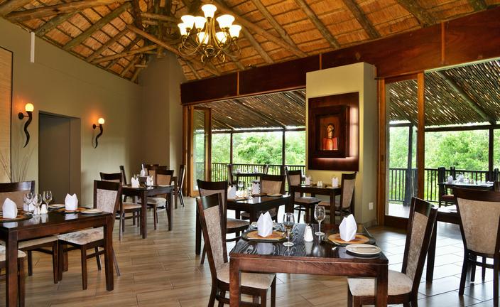Open-sided restaurant at Shishangeni Main Lodge in Kruger National Park, offering relaxed dining with views over the surrounding wilderness.